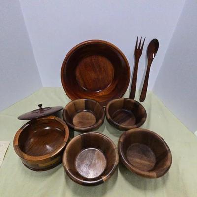 A Vintage wooden salad bowl set, likely from the mid-century modern era. 
