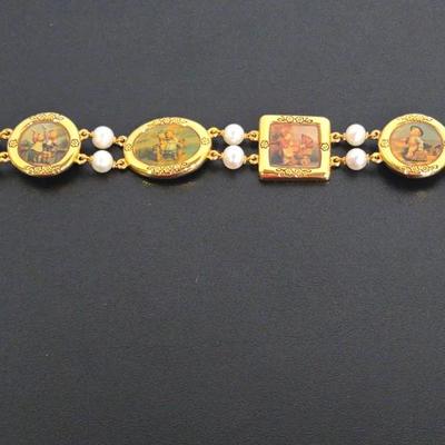 A Vintage Danbury Mint M.I. Hummel Charm Bracelet.
