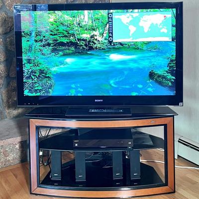 Sony Brava 52" Tv plus Dvd player, Sony speakers and subwoofer, and modern corner stand