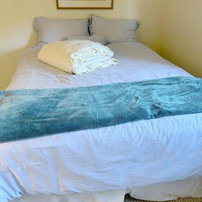 Several Down Feather Bed Toppers. 