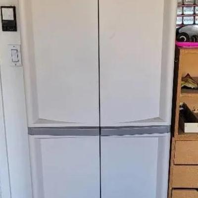 Rubbermaid Style Cabinets Full Of Cleaning Supplies
