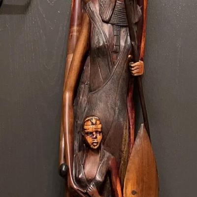 Large, carved wooden sculpture of a Massai family group