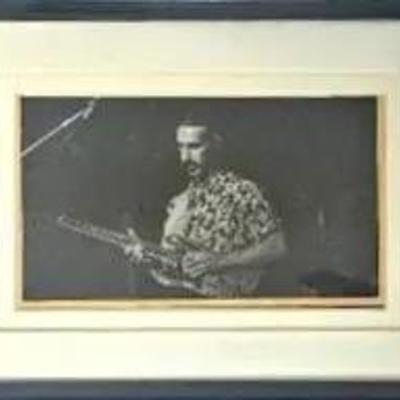 Man Playing the Guitar