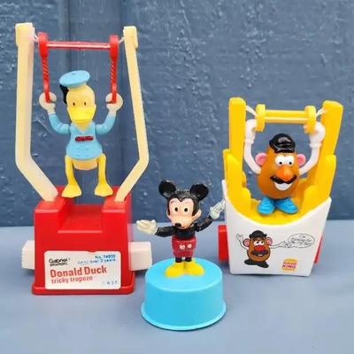 Set of 3 Vintage Character Toys – Donald Duck Trapeze, Mr. Potato Head, and Mickey Mouse
