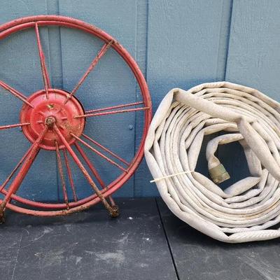 Vintage Fire Hose with Red Metal Reel
