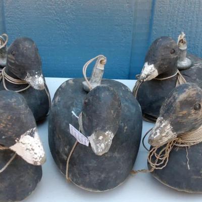 Five hand-carved wooden duck decoys with glass eyes and lead head weights. Classic vintage waterfowl
