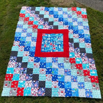 Window Quilt Design Featuring Penguins in Winter