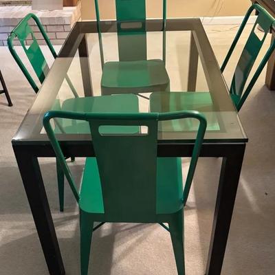 Metal And Glass Table With 4 Metal Green Chairs  