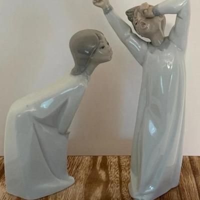 Lladro Boy Yawning And Girl Kissing Figurines