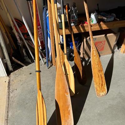 Assortment Of Wooden Paddles And Oars 