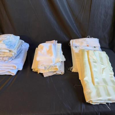 Lot 402: Lot of Neutral and Pastel Fabric Remnants – Whites, Creams, Blues, and Light Patterns