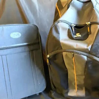 Lot 104:  Jeep Black Rolling Backpack with Telescopic Handle and Orange Trim