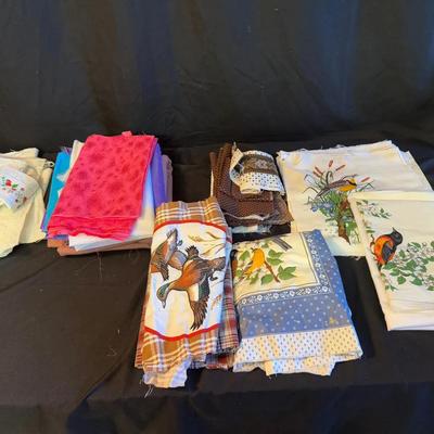 Lot 407: Lot of Assorted Fabric Remnants – Bird Prints, Florals, Solids, and Patterned Cotton Blends