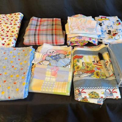 Lot 416: Lot of Assorted Fabric Prints – Cartoon, Floral, Plaid, and Patterned Cotton Blends