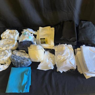 Lot 428: Large Lot of Mixed Fabric Remnants – Black, White, Blue, and Patterned Prints