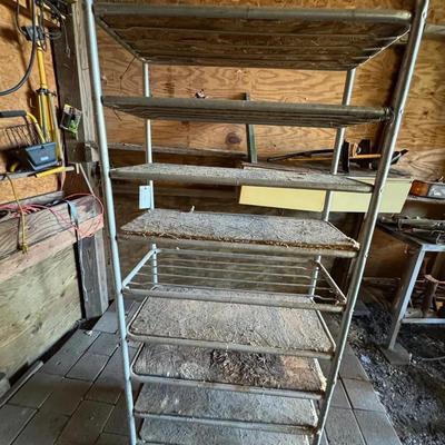 Lot 245: Metal 9 Shelf Utility Shelf With Wheels