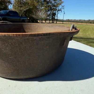Lot 542: Lodge USA Cast Iron Dutch Oven with Lid – 10.5” Wide, 4” Deep, Self-Basting Top