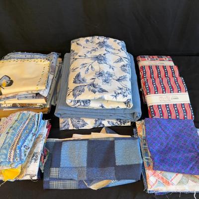 Lot 424: Large Lot of Quilting & Sewing Fabrics – Blue Floral, Patriotic Prints, and Mixed Cotton Pi