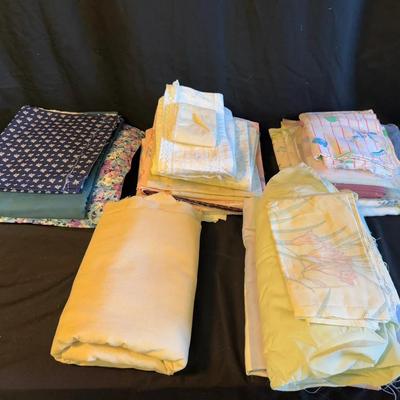 Lot 415: Lot of Assorted Fabric Yardage and Remnants – Floral, Solid, and Patterned Cotton Blends