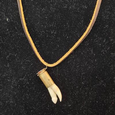 Vintage Hand Carved Wolf Tooth in Bullet Casing on Leather Cord