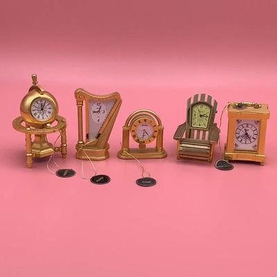 Five Miniature Brass Bulova Clocks