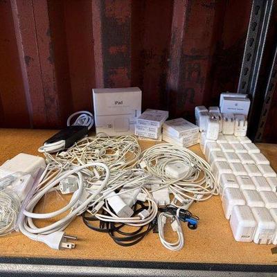 6052 • assorted usb power adapters, charging cords, and headphones