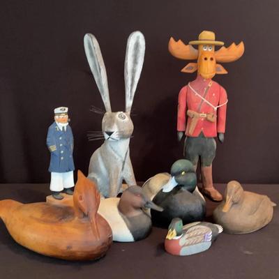 Hand-carved wooden figurine of a moose, Ducks, Sea Captain & Hare