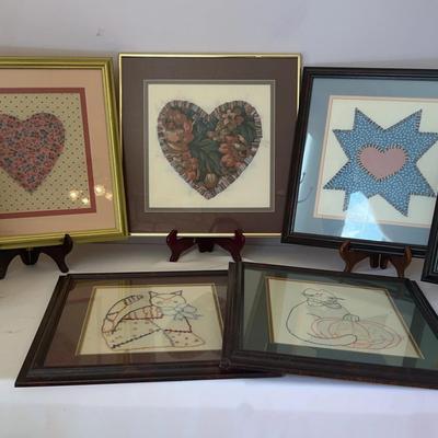 Framed piece of embroidery art, specifically a type of Needlepoint