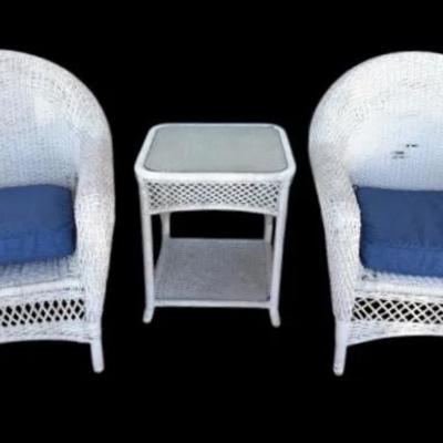 White wicker chairs and table patio set