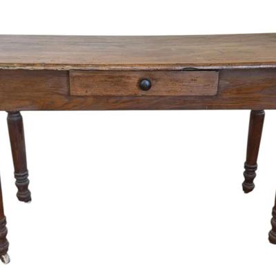 Wooden desk on wheels, possibly an antique