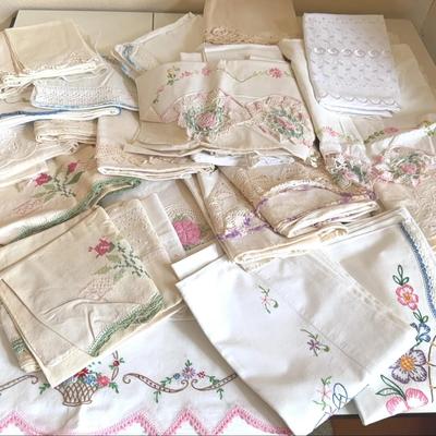 Large collection of vintage hand-embroidered tablecloths/linens