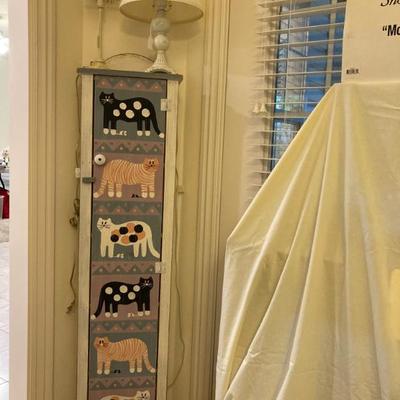 Sale Photo Thumbnail #53: Tall narrow storage cabiinet