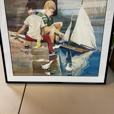 Boys working on their sailboat 