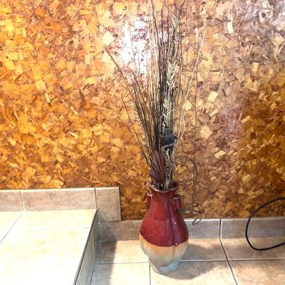 Handcrafted Pottery Vase With Decorative Sticks