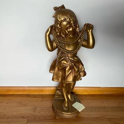 Large Gold Colored Girl Statue