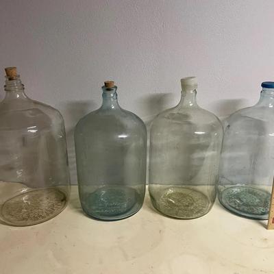Four Large Glass Jugs