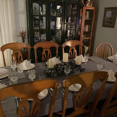 Sale Photo Thumbnail #10: Wood Dining table with six chairs.  Glass top. Legs and underside are hunter green.  Chairs have green upholstered cushions.
Has matching hutch. 