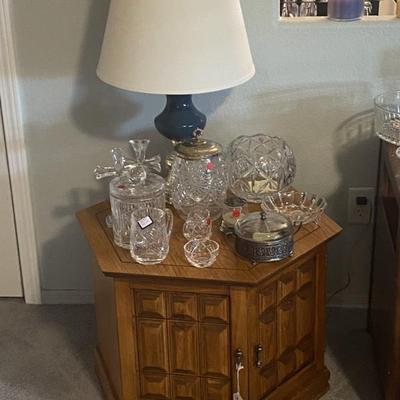 Sale Photo Thumbnail #13: Vintage hexagon end table with storage.  Has matching square table. 
Also shown: lamp, Waterford and Lenox crystal,  vintage crystal