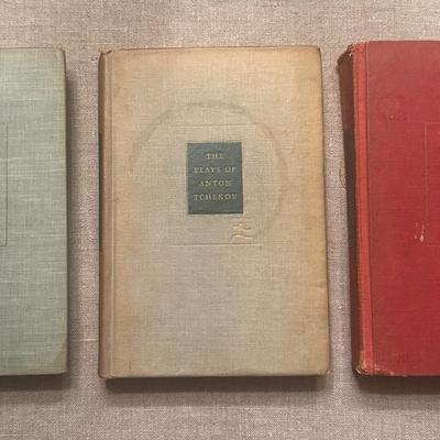 A set of three vintage hardcover books from the Modern Library series.