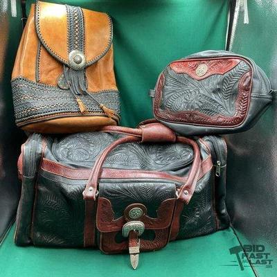 398 • three western style leather travel bags
