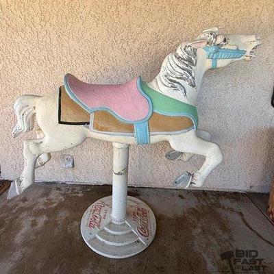 40 • carousel horse on cast iron coca cola stand
