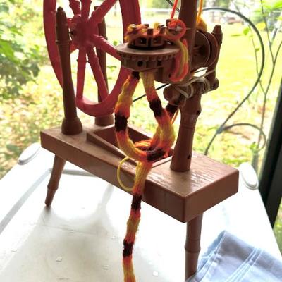 Sale Photo Thumbnail #60: Small plastic child’s spinning wheel 