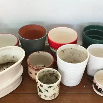 An Assortment Of Mostly Ceramic Planter Pots