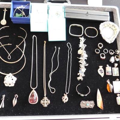 Case of silver and gold jewelry