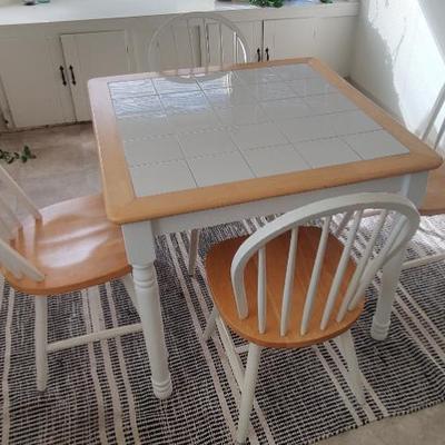 Tile top kitchenette table with four chairs