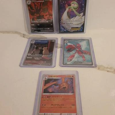 Pokémon Cards In Protective Cases
