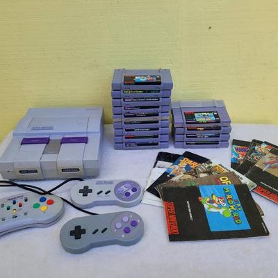 Super Nintendo With Remotes, Games, And Power Cords