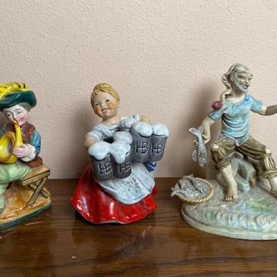 Porcelain Figurines – Musician, Beer Maiden, and Fisherman