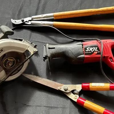 Assorted Hand and Power Tools on Workbench