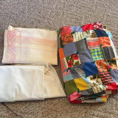 Two Table Cloths And A Very Large Quilted Blanket